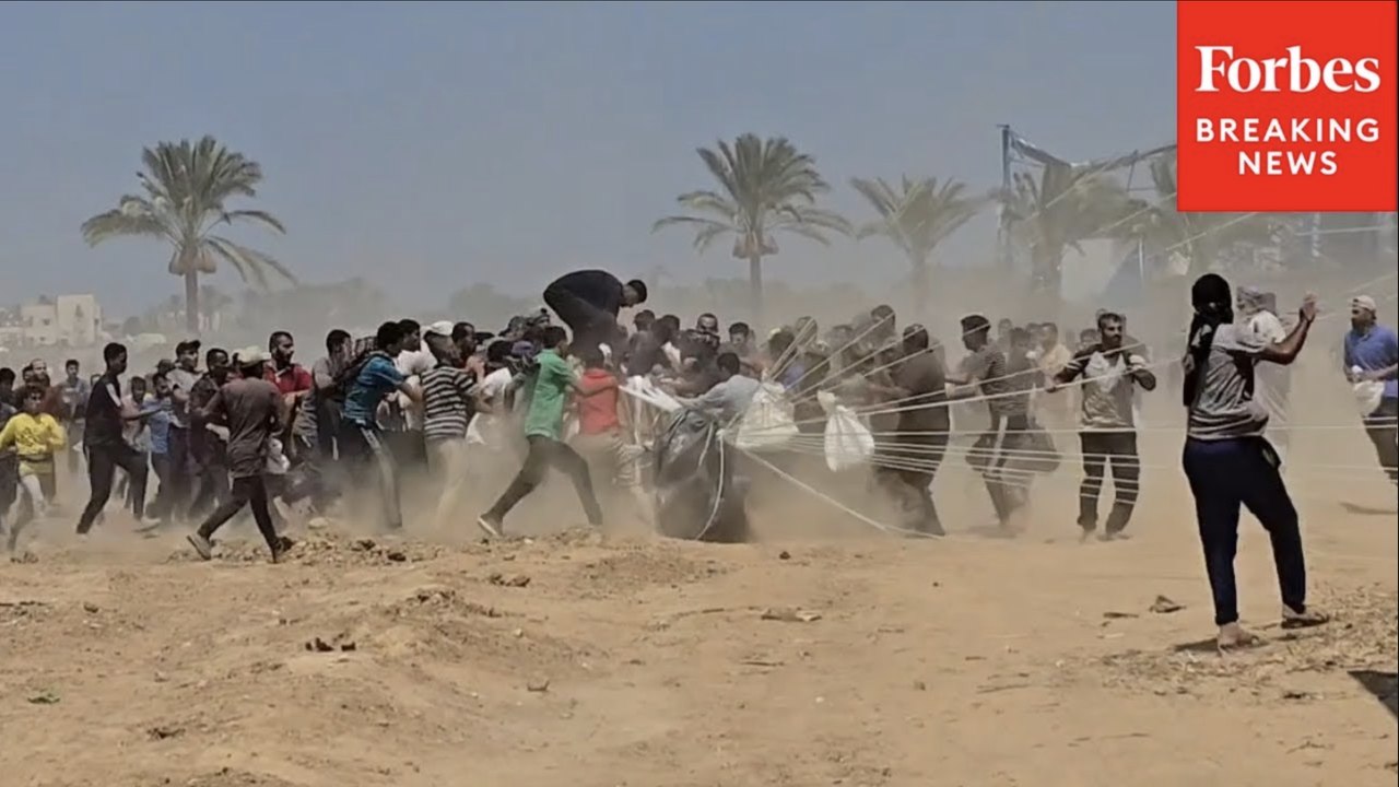 Palestinians Rush To Humanitarian Aid Airdropped Into Gaza