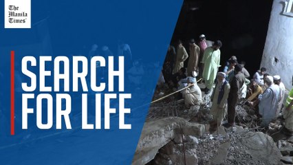 Rescue workers and residents search for victims of cloudburst in Pakistan