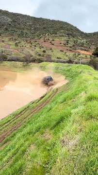 SUV Splashes Into Water and Gets Submerged