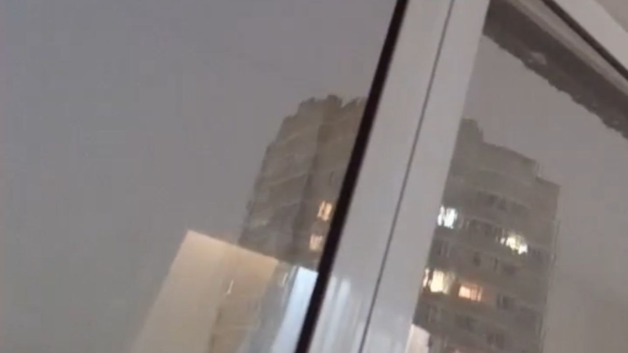 Heavy rain and strong winds make the window frames shake wildly