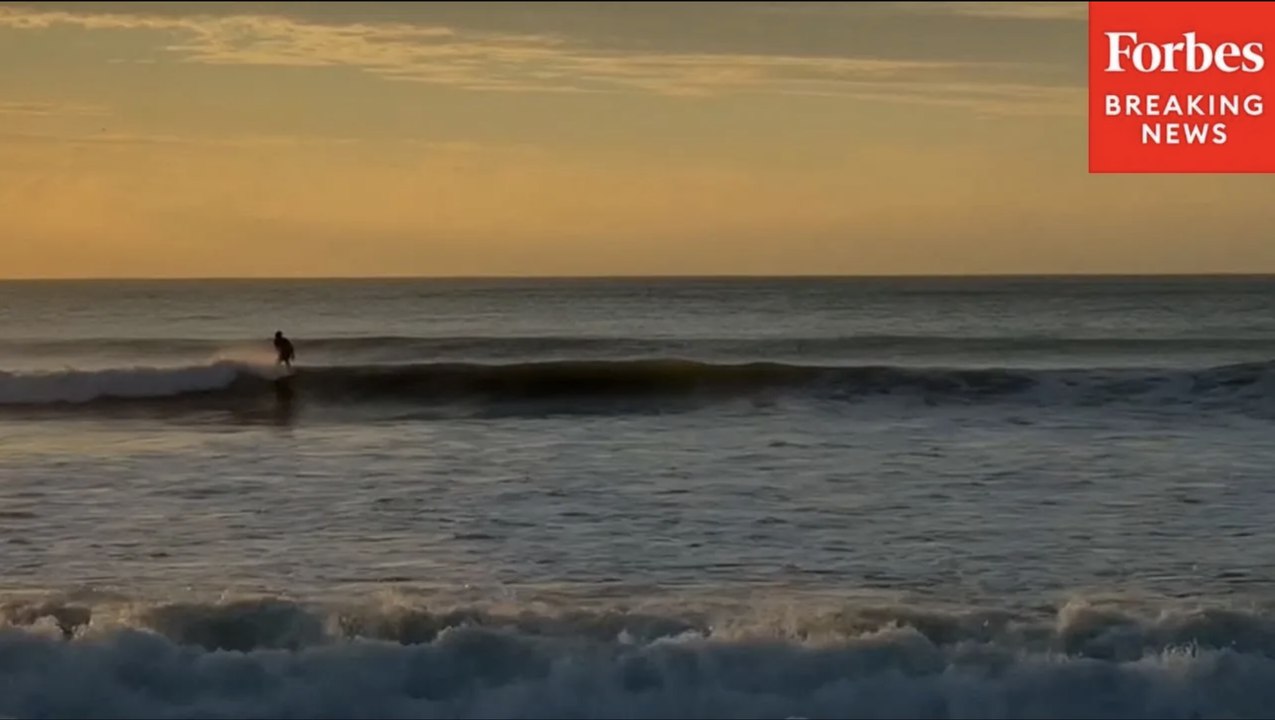 Surfers Surf Hurricane Erin's Waves As They Touch Down In Wrightsville Beach, North Carolina
