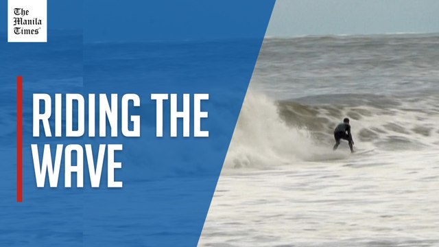 Surfers take advantage of swell caused by Hurricane Erin