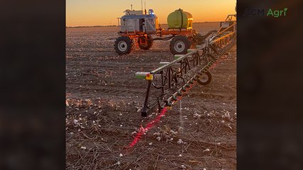SwarmBot tractor pulls spray rig near Walgett