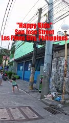 Happy Kids on San Jose Street in Las Pinas City in the Philippines