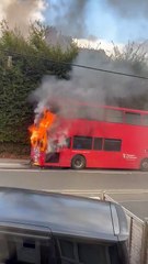 The Cornwall Go Bus can be seen ablaze at the side of the road. Video: Kelly Garrett