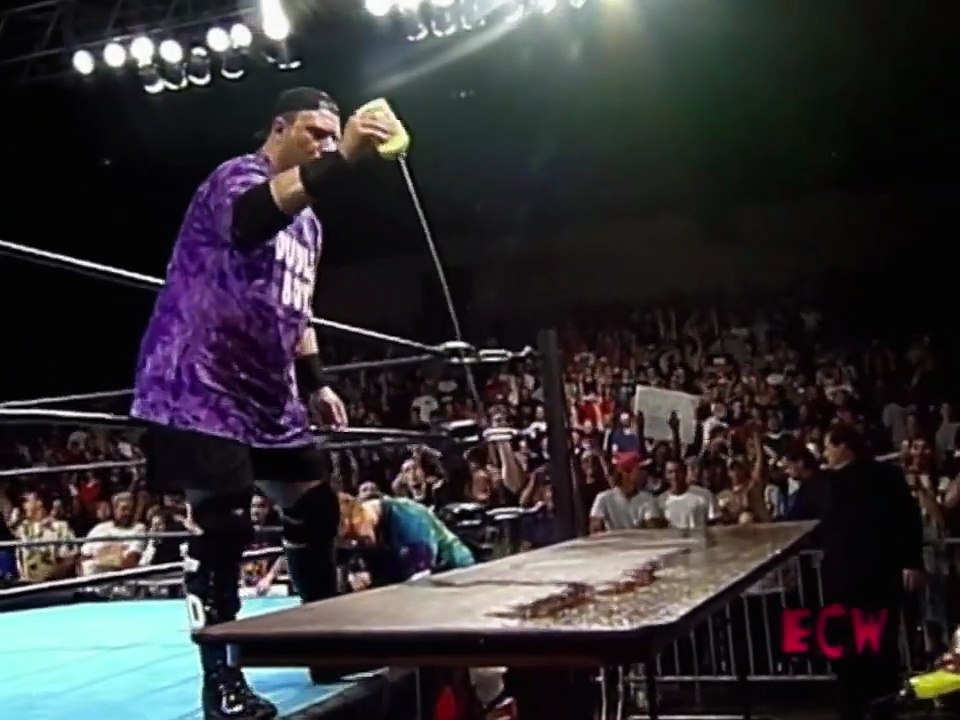 History of ECW - Bubba Ray Dudley Powerbombs Spike Dudley through stacked Flaming Table.