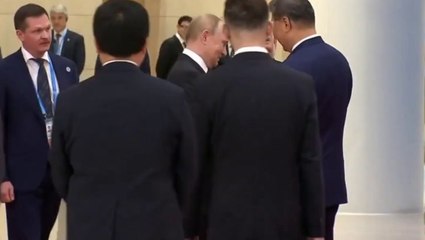 Putin and Modi hold hands as leaders gather for China summit