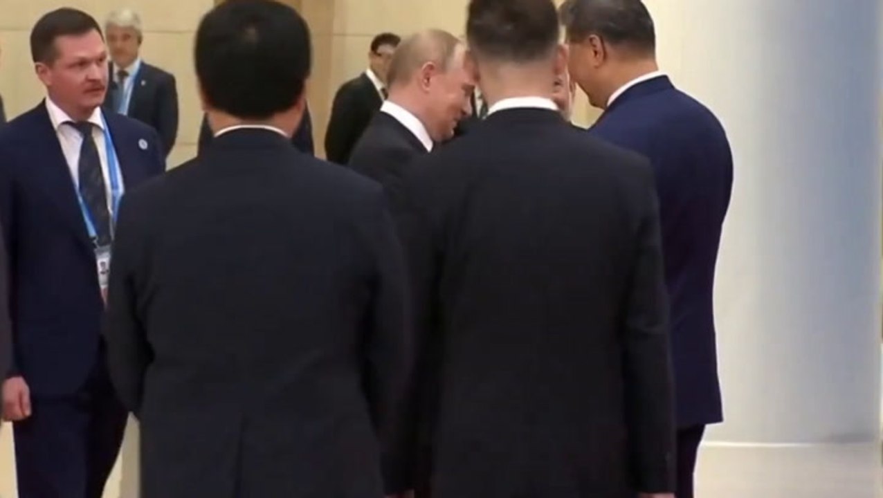 Putin and Modi hold hands as leaders gather for China summit