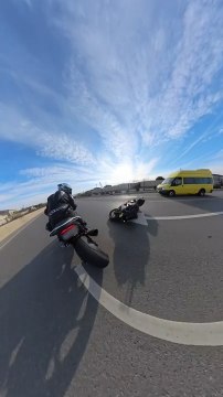 Motorcyclist Spots Another Motorcycle Slide Across Road