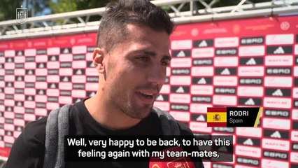 Rodri returns to Spain with a smile after 'tough' year away