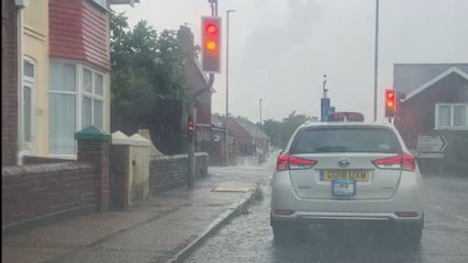 Footage shows driver battling flash flood waters after heavy rain across Eastbourne