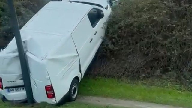 Confusing post-crash scene features van sandwiched in a nearly impossible position