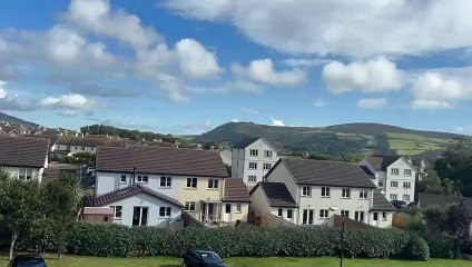 Air ambulance is seen above Peel as emergency services deal with an incident