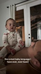 Adorable Baby Babbles Away While Sitting on Her Dad's Chest