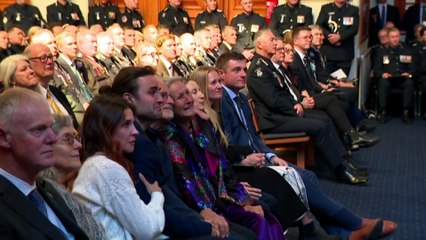Mouners gather for funeral of one of two officers killed in Porepunkah