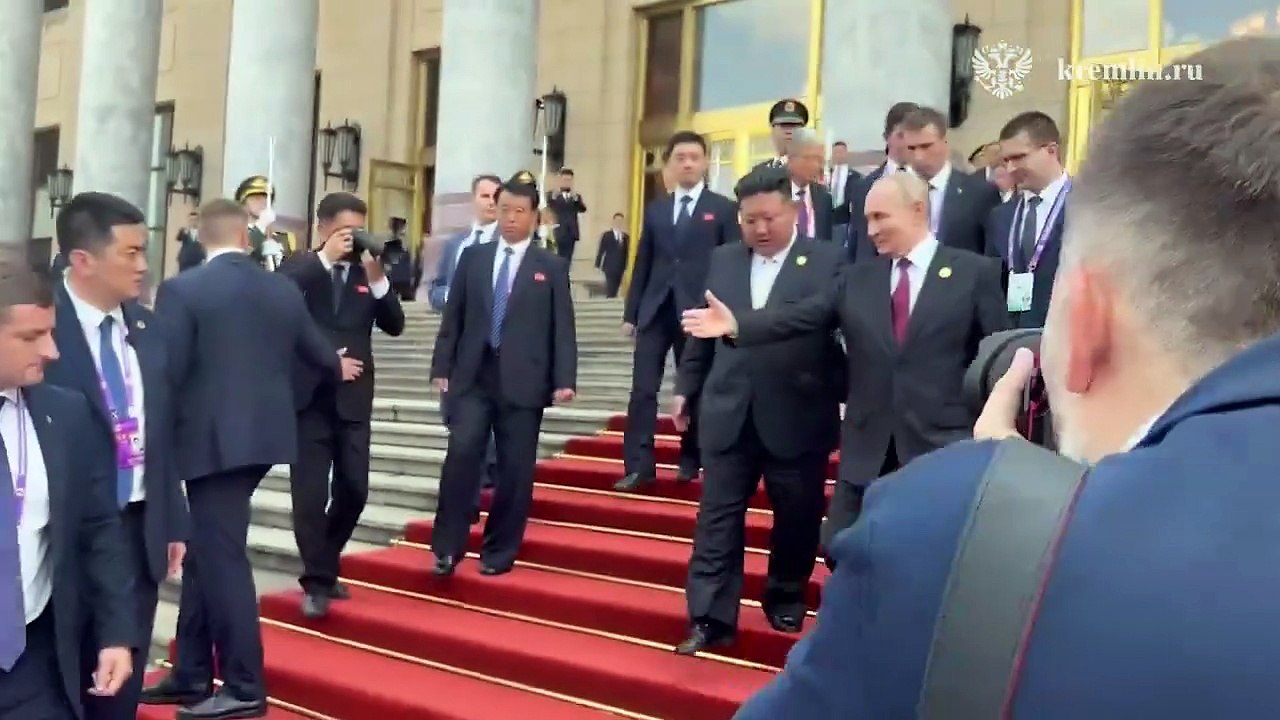 Russian President Putin and North Korea's President Kim Jong Un ride together in the same car.