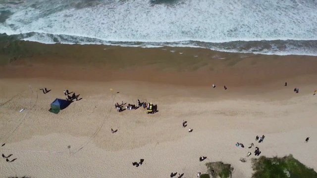 Drone footage shows helicopters off Sydney beach after shark kills surfer