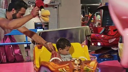 Little boy gets a tassel on carousel but instantly throws it off with style
