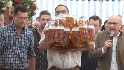 Pints go flying as waiter attempts to carry 31 beers in world record attempt