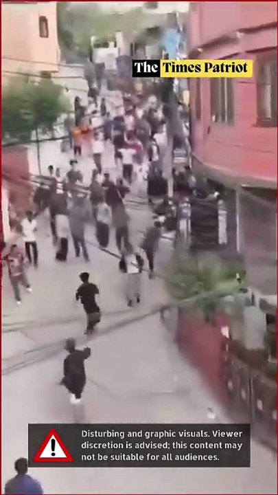 Nepal Protestors chase and beat Nepal’s Finance Minister Bishnu Prasad Paudel on the streets of Kathmandu.