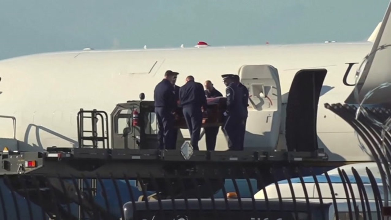 Charlie Kirk’s wife Erika clutches Usha Vance’s hand as casket arrives in Phoenix