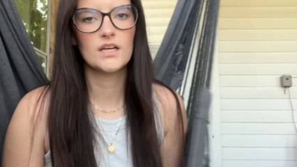 Porch swing gives way while woman films herself reading a book