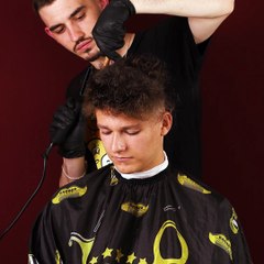 That long curly hair is gone