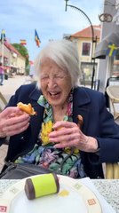Elderly Woman Gets Startled by Crow Trying to Snatch Food From Her Hand