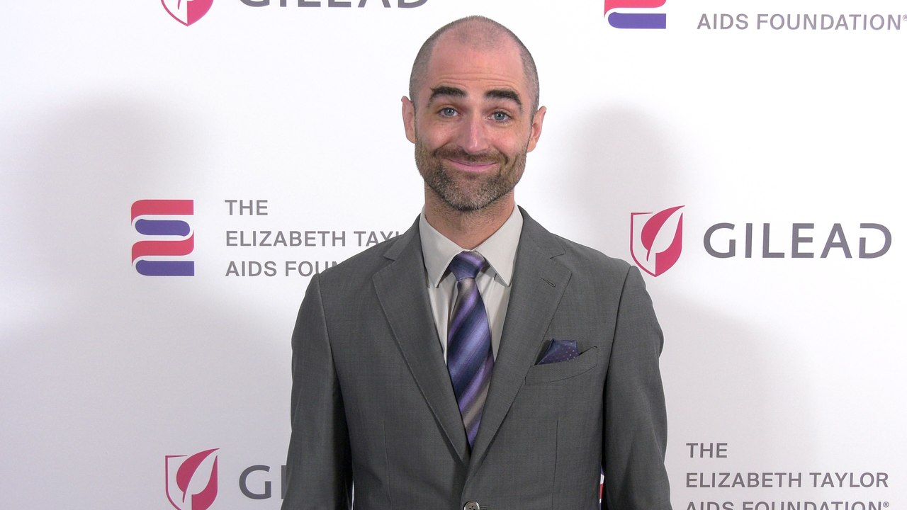 Quinn Tivey attends "The Elizabeth Taylor Night of Compassion" purple carpet