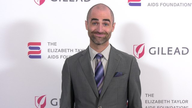 Quinn Tivey attends The Elizabeth Taylor Night of Compassion purple carpet