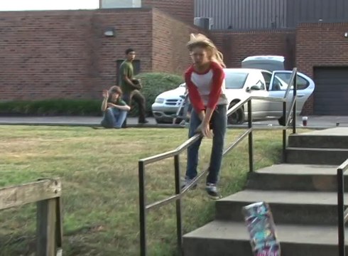 Skateboarder Falls After Losing Balance on Stair Railing