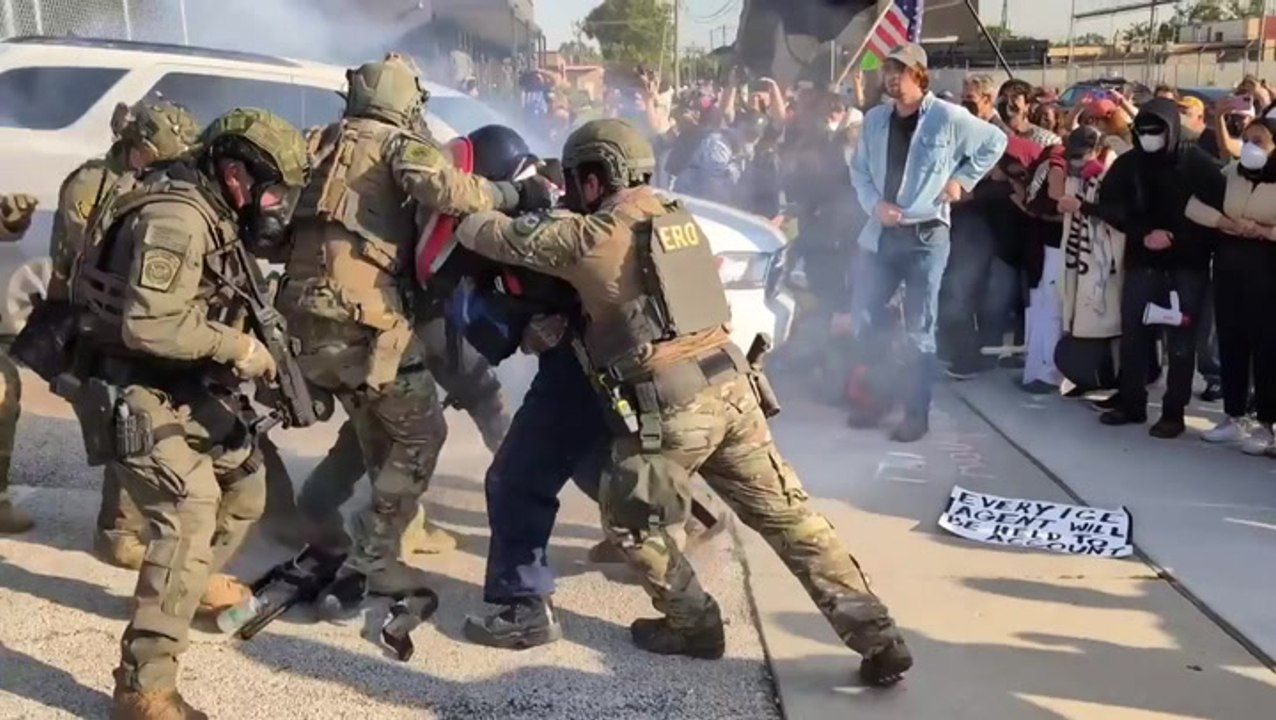 Protester with Captain America shield bundled into ICE facility in Chicago after throwing back tear gas canister
