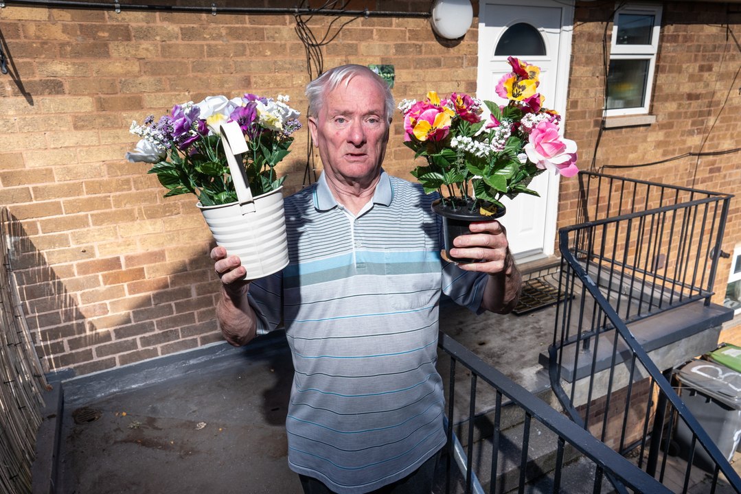 Couple banned from putting flower pots on balcony