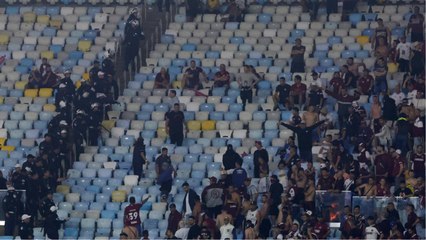 Clashes between Lanús fans and Brazilian police in the stands of the Maracanã