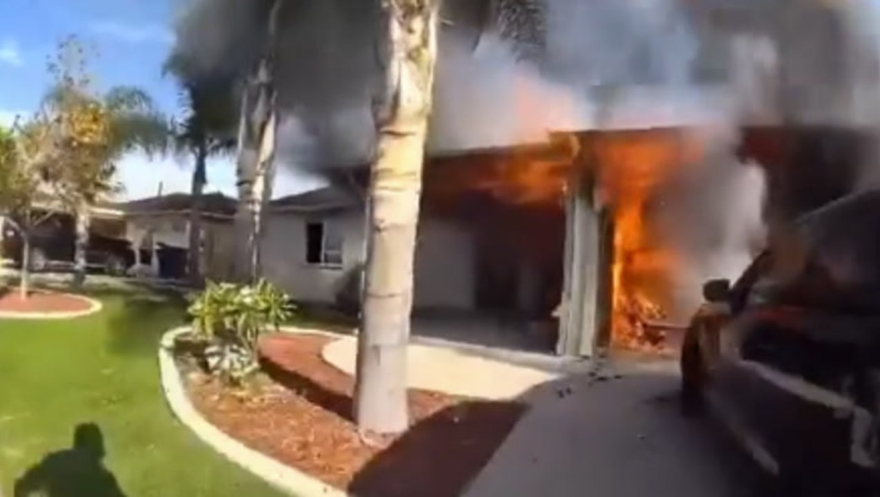 Police officers run into burning home to rescue woman in dramatic bodycam footage
