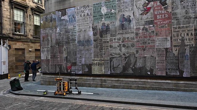 Vintage posters adorn Glasgow city centre lane as dressing for period drama gets underway