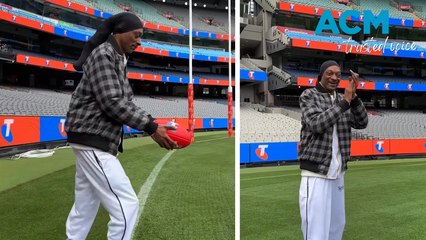 ‘I never tried’: Snoop Dogg aces AFL lesson at MCG