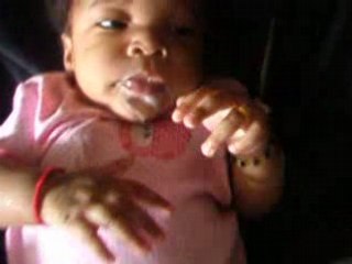 HOLDING BOTTLE AT 3 MONTHS