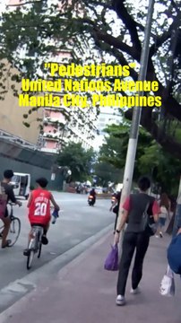Pedestrians on United Nations Avenue in Manila City, Philippines