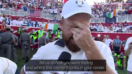 Lowry fights back tears after sinking putt to retain Ryder Cup
