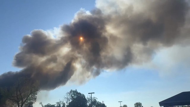 Michigan church erupts in flames after armed man crashes car and opens fire