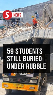 Rescuers deploy heavy machinery in Indonesia school collapse search