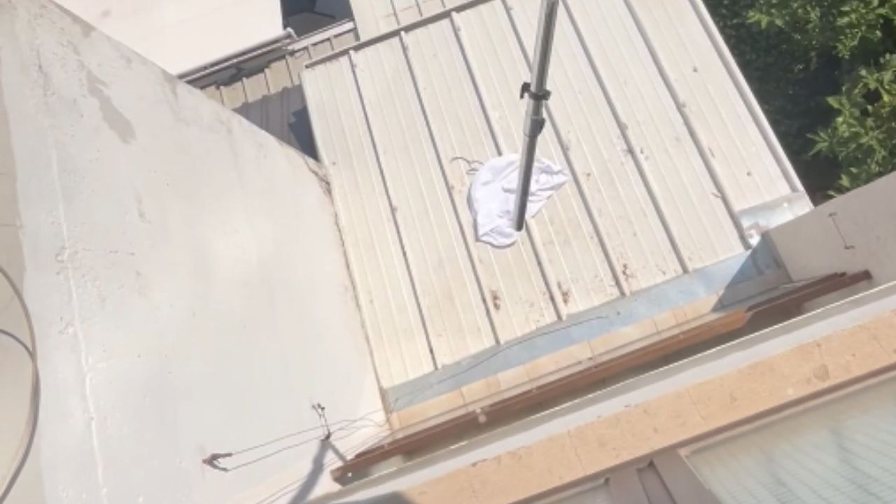 Boy uses vacuum cleaner to pick up a cloth instead of going downstairs