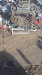 Machine Operator Uses Claws To Arrange Shoes on Shoerack