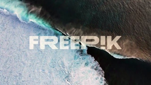 Aerial View of Powerful Ocean Waves Crashing on the Shore