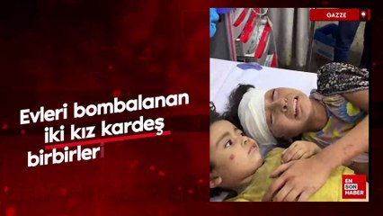 Gazze'de evleri bombalanan iki kız kardeş birbirlerine sarıldı