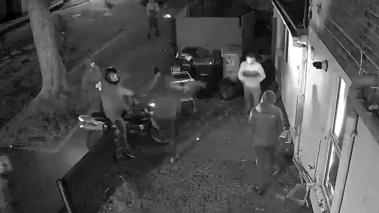 Dramatic footage of moment  12 men, one on motorbike, storm property in Skegness