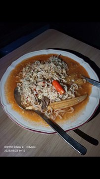 Sweet curry noodles with sardines, eggs and baby corns.