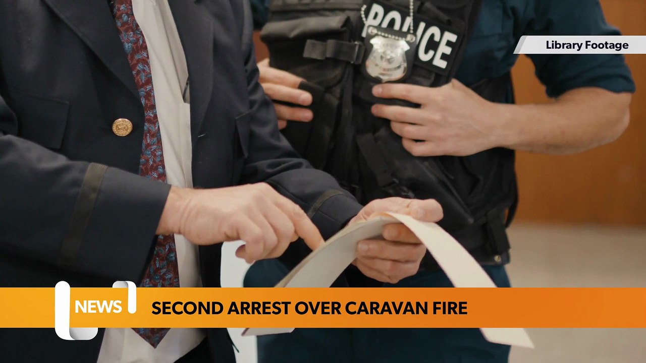 Second man arrested after caravan fire
