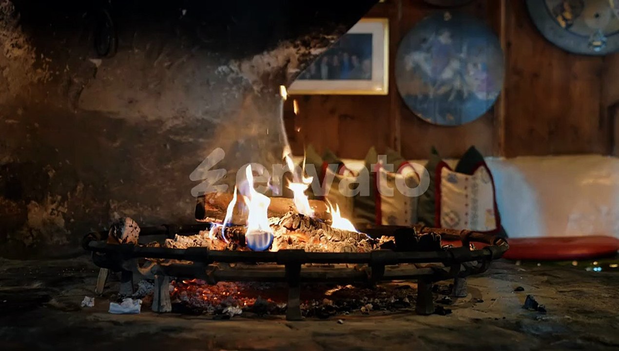 Fireplace. Cozy Relaxing Fireplace. Firewood. Flames of a country house. Warmth and home comfort.